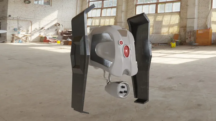 A white and grey robot drone with two dark wing panels in an empty warehouse